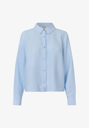 Heled sinine nööbitav särk, millel on kraega kaelus, pikad varrukad ja veidi relaxed lõige. Tekstuuriga kangas, minimalistlik disain ja ilma mustriteta.