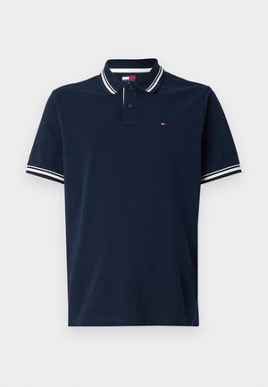 Marinblå polo t-shirt i bomull, med klassisk krage, två knappslå och vita randiga detaljer på ärmarna.