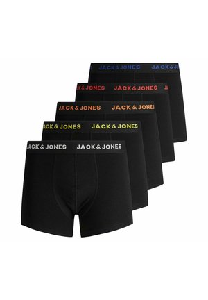 Shirtless man wearing black boxer briefs with "JACK & JONES" orange logo waistband, standing against a plain light gray background.