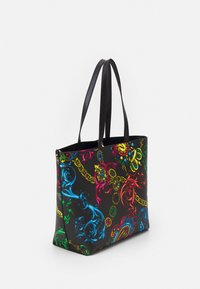 Black tote bag with double black handles and vibrant multicolor baroque and chain print design.