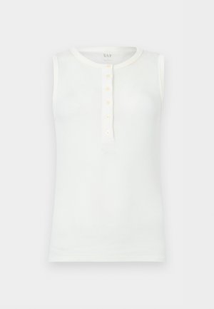 Haut blanc sans manches en coton côtelé avec encolure ronde et patte de boutonnage à cinq boutons sur le devant, posé à plat sur un fond clair.