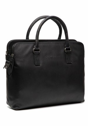 Sacoche en cuir noir pour ordinateur portable avec deux poignées supérieures, une fermeture à zip et un branding subtil. Texture lisse et design structuré adapté à un usage professionnel.
