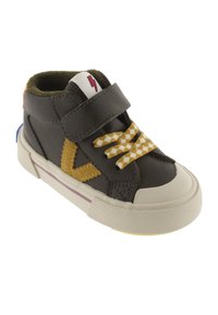 Child's dark brown high-top sneaker with yellow checkered laces, yellow side stripe, white sole, and velcro strap with red lightning symbol.