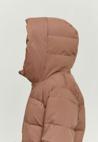 Brown puffer jacket with a hood, featuring a quilted design, smooth texture, and a subtle logo on the left shoulder.