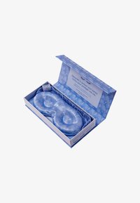 Maschera per gli occhi imbottita blu in una scatola decorata. La maschera presenta un design trapuntato con bordi elastici per una vestibilità sicura.