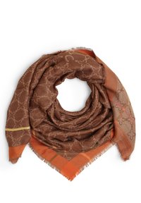 Écharpe marron avec un motif floral en chaîne marron clair, bords à carreaux orange et beige, et détails à franges, disposée en boucle circulaire.