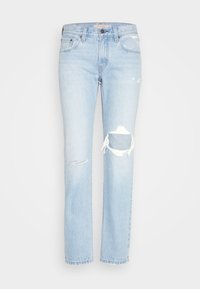 Světle modré džíny z denimu s volným střihem, s potrhanými detaily na kolenou, roztrhanými okraji a standardním pětipocket designem.