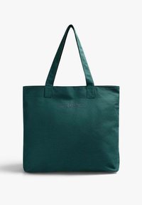 Bolsa tote de lona verde con dos asas superiores, una forma rectangular simple y un sutil bordado "Sealpers" en el frente.