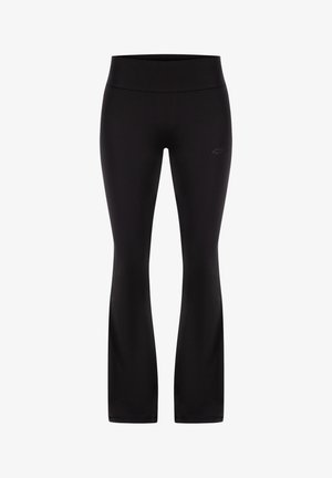 Černé legíny vyrobené z elastického materiálu, s přiléhavým pasem a rozšířenými nohavicemi. Diskrétní logo detail poblíž pasu.