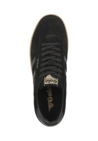 Black suede sneaker with black laces, a tan rubber sole, and a gold logo on the tongue. Two gold stripes on the sides.