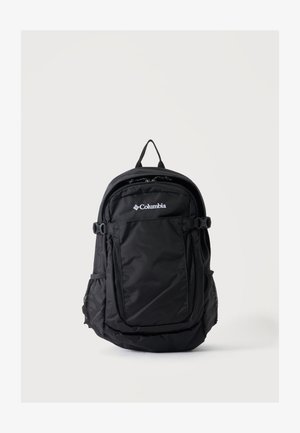 Sac à dos noir Columbia avec poche avant zippée, poches latérales en mesh, poignée supérieure et bretelles réglables sur fond clair uni.