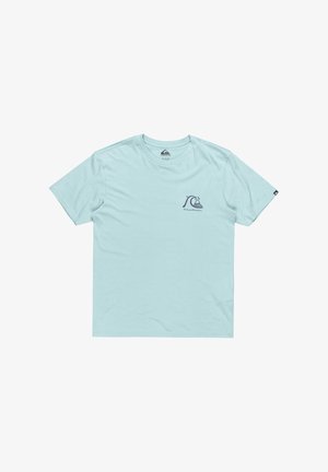 Light blue cotton t-shirt featuring short sleeves and a small navy logo on the left chest. Smooth texture with a classic crew neck design.