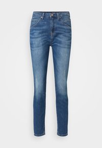 Skinny jeans in medium blue denim, featuring a high waist, five-pocket design, and a faded finish, with a classic button closure.