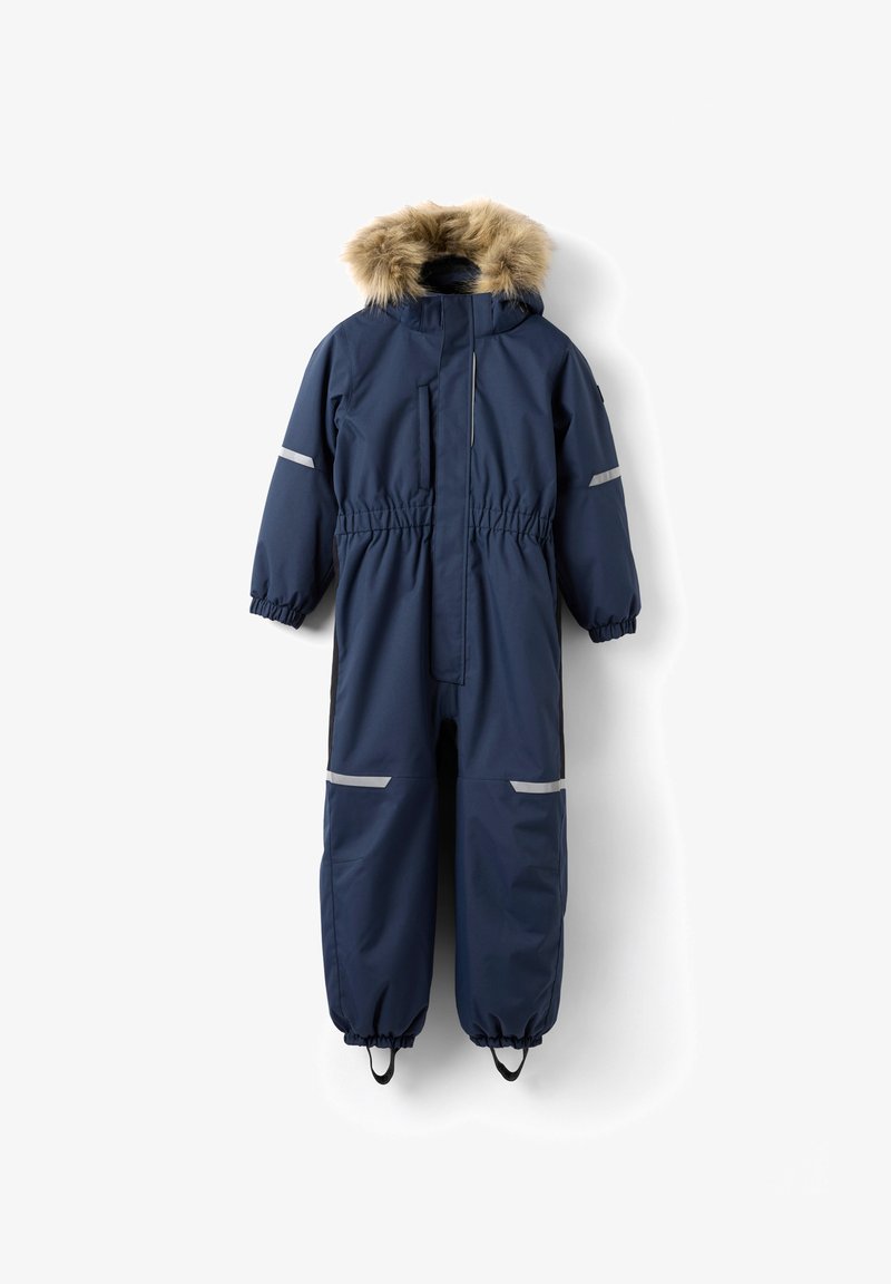 Marineblå ensfarvet vinterdragt med pelsforet hætte, elastisk talje og reflekterende detaljer. Justerbare ærmer og ankelremme for bedre pasform.