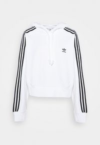Vit kortärmad hoodie med dragsnöre, med svarta tre-stripes detaljer längs ärmarna och en liten svart Adidas-logotyp på bröstet.