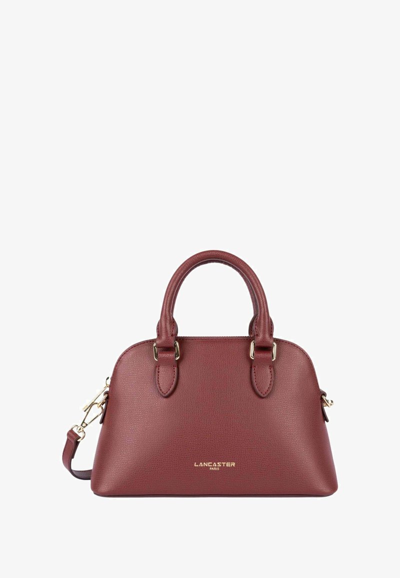 Borsa in pelle bordeaux con doppio manico, dettagli in metallo dorato, texture a poro di pesca e tracolla removibile. Dimensioni piccole.