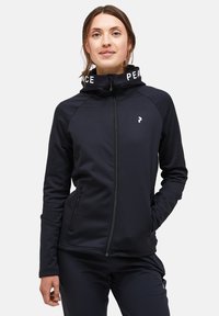 Zippered black athletic jacket with a high collar. Features white "PEACE" text on the collar, smooth texture, and raglan sleeves.
