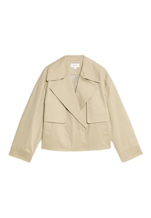 Veste beige cropped avec grand col, poches plates et manches longues. Fabriquée dans un tissu lisse et texturé avec un design minimaliste.