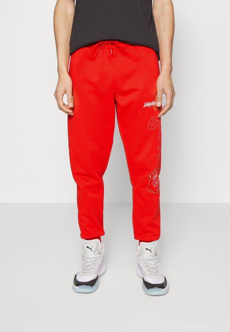 Puma MIKEY DAYGO Tracksuit bottoms for all time red/red Zalando.ie