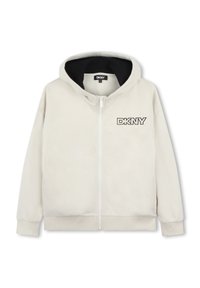 Haut à capuche zippé beige clair en tissu doux. Présente une doublure intérieure noire et un logo DKNY brodé sur la poitrine gauche. Manches longues.