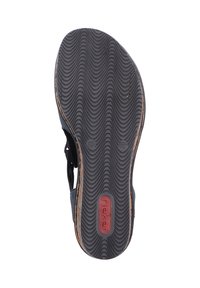 Black rubber sandal sole with wave pattern, featuring a red logo and size markings. Durable and textured for traction.