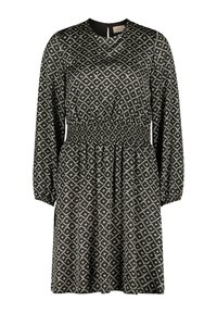 Langärmliges schwarzes Kleid mit geometrischem creamfarbenem Muster, geraffte Taille für eine gute Passform, runder Ausschnitt und ein Schlüssellochverschluss im Rücken.