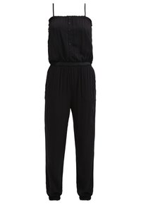 Combinaison noire sans manches avec fines bretelles, corsage boutonné devant, taille élastique et jambes fuselées avec poignets aux chevilles.