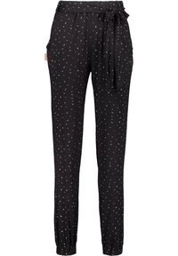 Černé kalhoty s páskem na stažení v pase, zdobené rozptýleným vícebarevným puntíkovým vzorem. Materiál vypadá měkce a má pružné manžety na kotnících.
