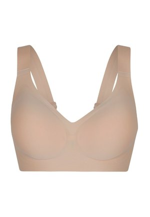 Sammenhængende trådløs BH i hudfarve med brede, justerbare stropper og bløde, formstøbte skåle for komfort og støtte.