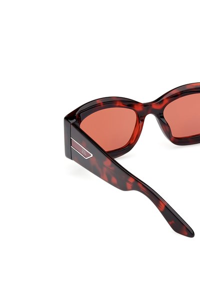 Tortoiseshell sunglasses with red-tinted lenses, wide rectangular frames, and a silver accent on the temple. Smooth plastic material.