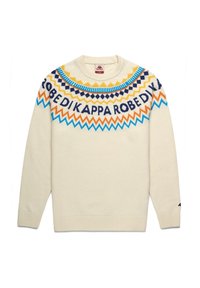 Maglione color crema con un motivo geometrico circolare blu, arancione e navy attorno al collo e una scritta audace.