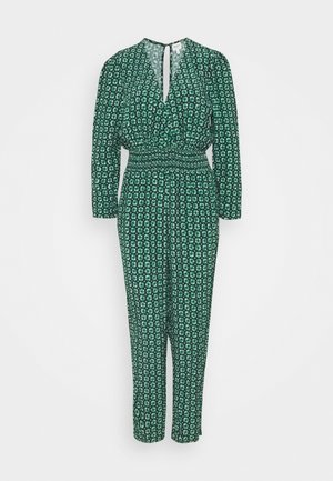 Combinaison verte à manches longues, motif floral blanc, taille élastique, col en V avec ouverture en trou de serrure et fermeture par bouton à l'arrière.