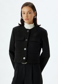 Chaqueta fina - black