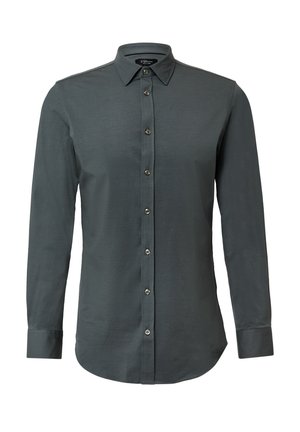 Chemise boutonnée grise foncée avec un col, des manches longues et une texture lisse. Présente six boutons sur le devant avec un ourlet arrondi.