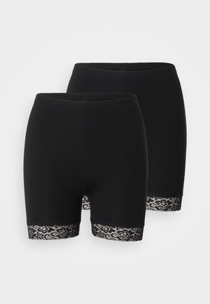 Shorts en coton noir avec une coupe ajustée, présentant une dentelle décorative au niveau de l'ourlet. Pas de poches ni de détails matériels supplémentaires.