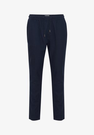 Marineblå bukser lavet af letvægtsstof, med en elastisk talje og snoretræk samt tapered ben. Ingen synlige mønstre eller accenter.