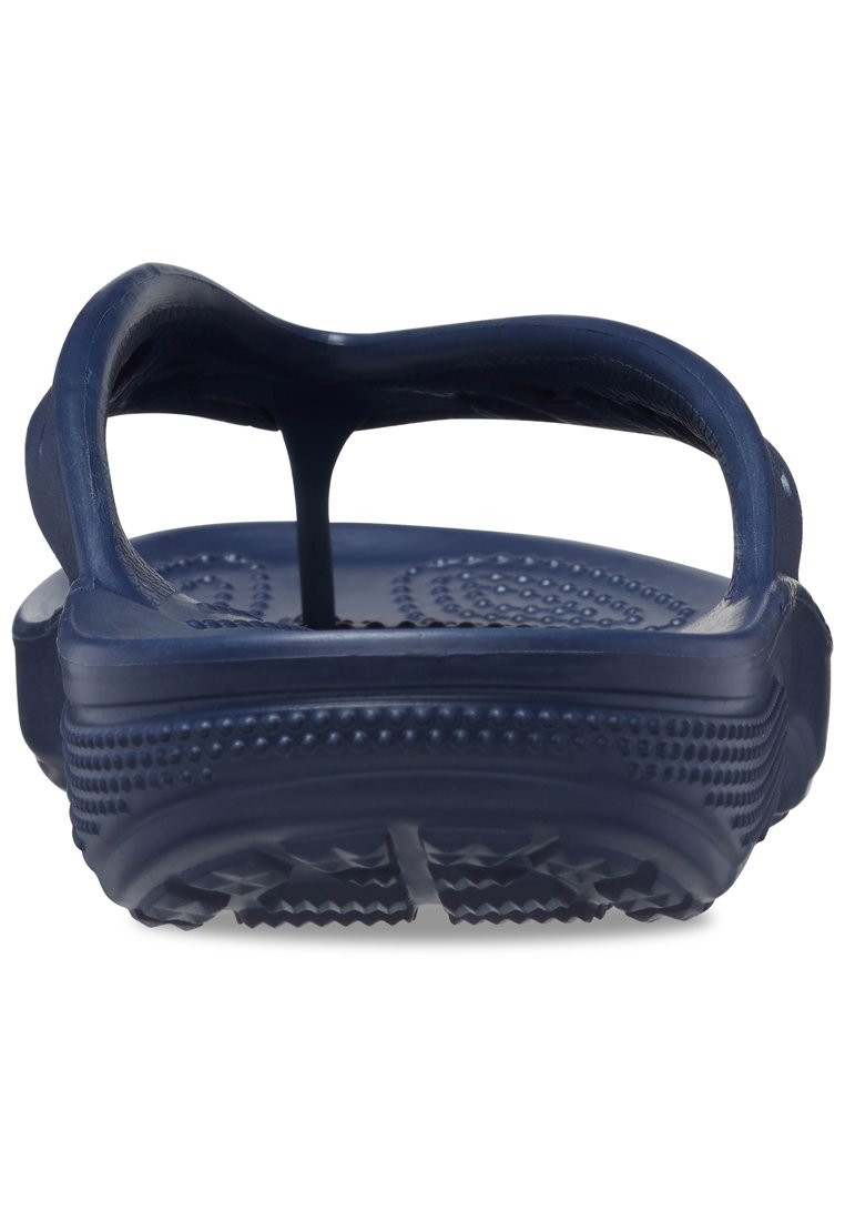 Marineblaue Gummisandale mit konturiertem Fußbett, strukturiertem Sohlen und einem einzelnen Zehensteg. Verfügt über kreisförmige und gepunktete Muster.