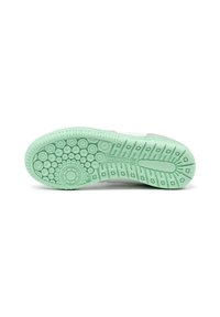 Suela de zapato de goma verde menta, con patrones de agarre circulares y rectangulares, con una textura suave y marca "MUNICH X."