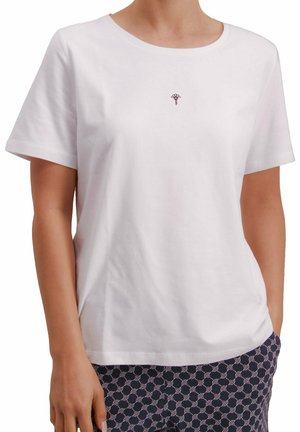 T-shirt en coton blanc à manches courtes et col rond, arborant un petit motif brodé sur la poitrine. Texture lisse.