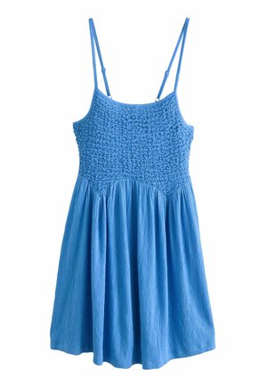 Robe bleue sans manches avec corsage smocké et bretelles fines réglables, suspendue sur fond blanc.