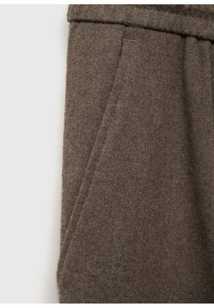Brown wool blend trouser fabric featuring a side pocket with a clean seam and soft texture, presented in a close-up view.