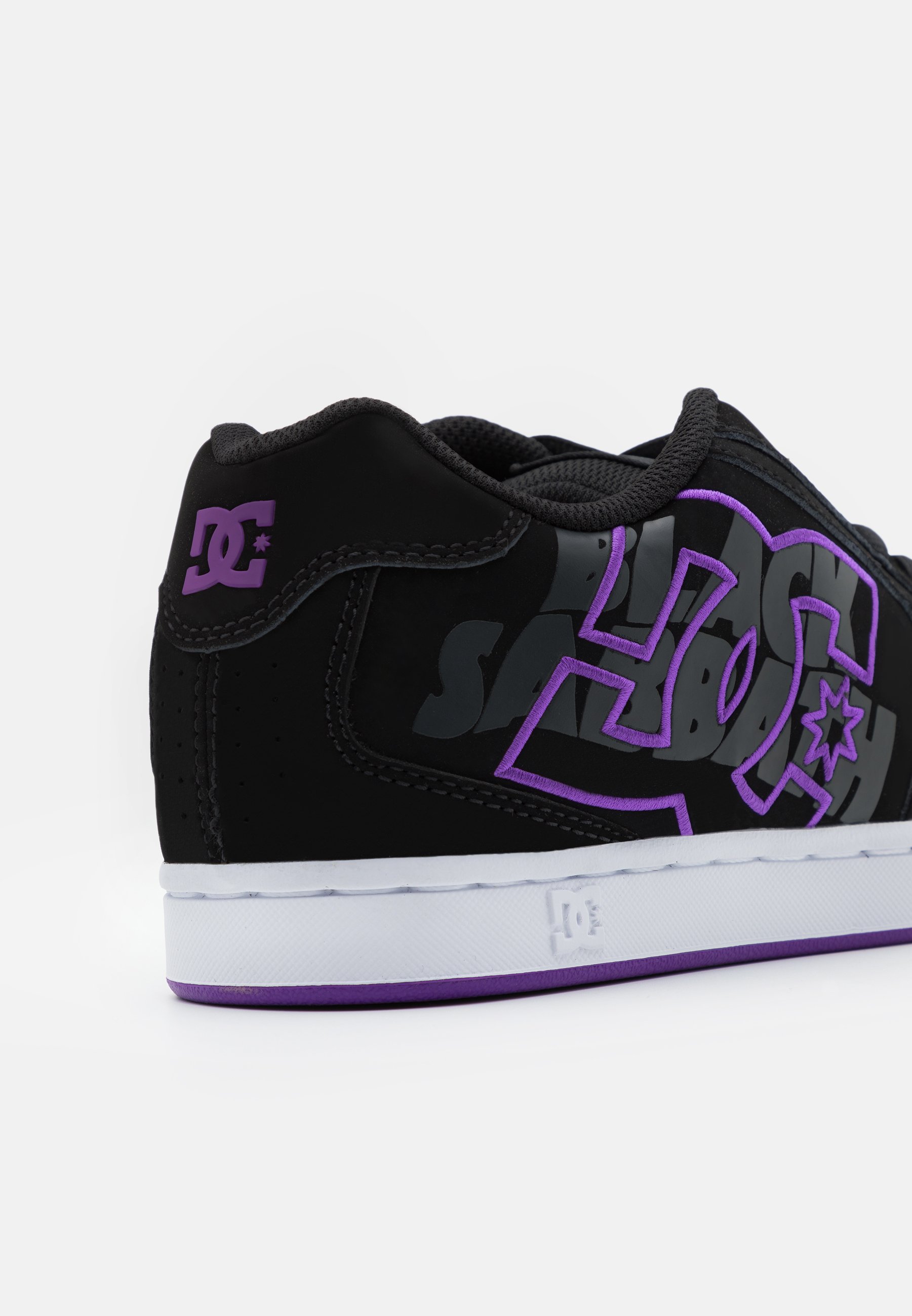 black and purple dc shoes