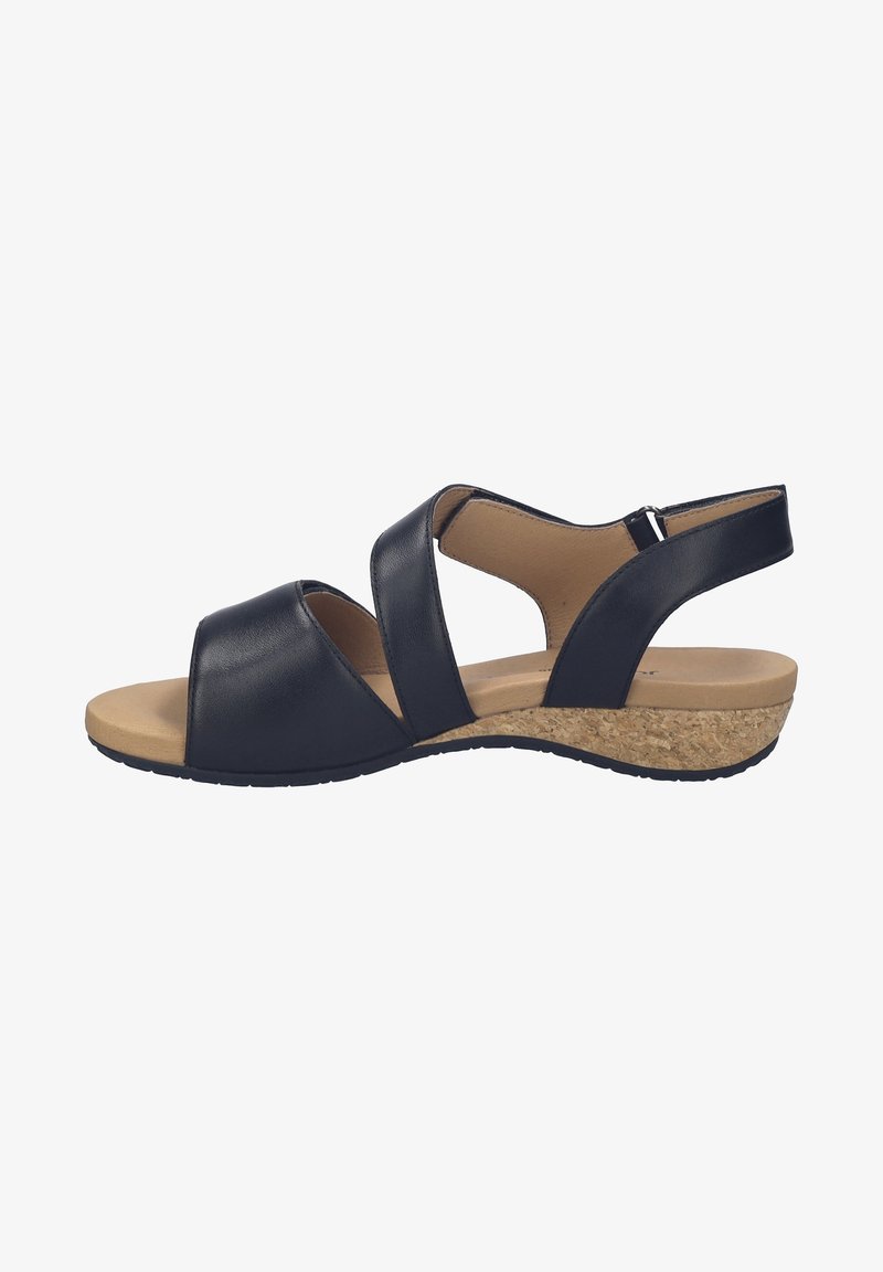 Sandales en cuir noir avec une semelle compensée en liège, dotées de deux larges brides croisées à l'avant et d'une bride arrière réglable.