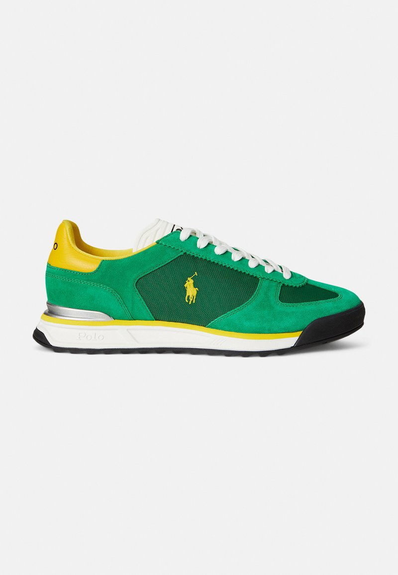Green and yellow athletic sneaker made of suede and mesh, featuring white laces, a logo, and a textured black rubber sole.