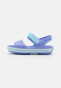 Purple and light blue sandals with a strap, vent holes, and textured soles. Made of lightweight material, featuring a round logo accent.