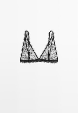 Bralette in pizzo nero con forma triangolare, caratterizzato da tessuto trasparente, bordi sfrangiati e spalline sottili e regolabili. Senza ferretto.
