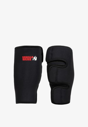 Zwarte polsbandjes met klittenbandsluitingen, waarvan één het rode Gorilla Wear-logo toont met een witte gorillagrafiek.