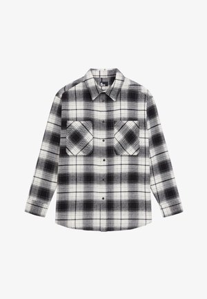 Camicia di flanella a quadri bianca e nera con maniche lunghe, chiusura frontale con bottoni e due tasche sul petto.