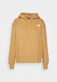 Sweat à capuche couleur chameau avec poche kangourou frontale, capuche réglable à cordon, poignets et ourlet côtelés, et logo blanc The North Face sur la poitrine.
