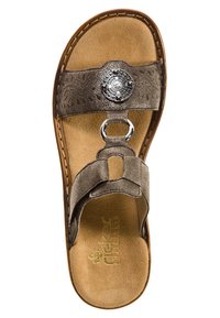 Brown sandal with a textured strap, circular metallic embellishment, and a soft suede-like footbed. Open toe design with a flat sole.